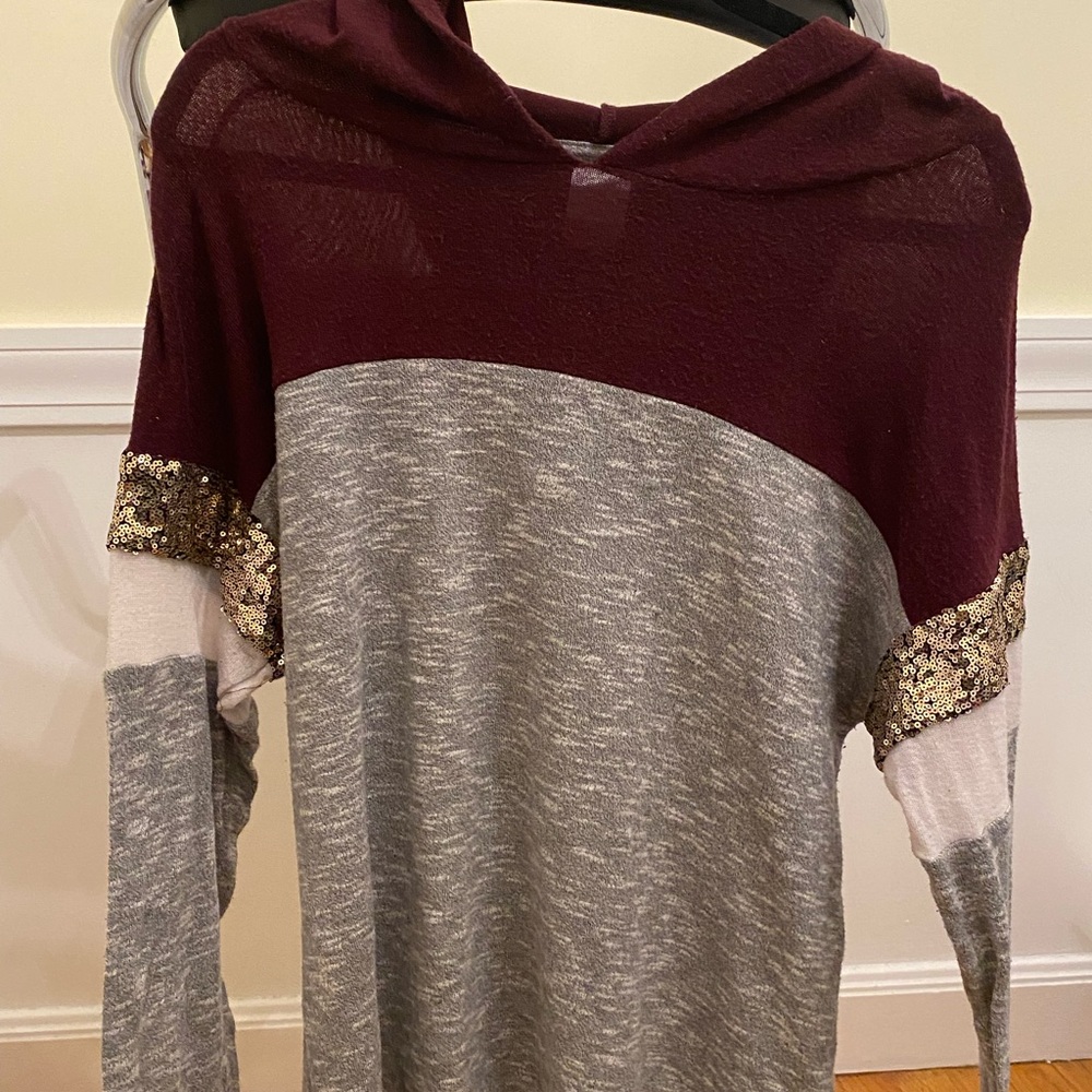 Long sleeve shirt with hood.